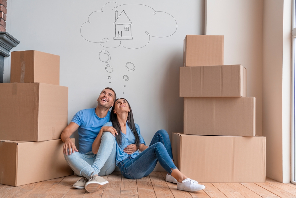 Young,Family,With,Dreaming,About,Moving,Into,New,House.,Break,